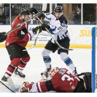 Idaho Steelheads fight for the puck in front of the Rapid City Rush net