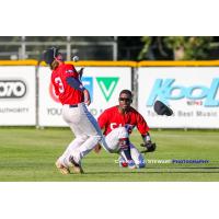 With outfielder AJ Lewis losing his cap, Victoria HarbourCats second baseman Rowdy Jordan makes a great catch