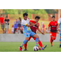 Las Lights FC's Carlos Alvarez (left) battles for possession against Rio Grande Valley FC