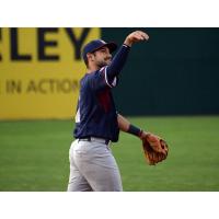 Alfredo Rodriguez of the Somerset Patriots tosses a ball into the crowd