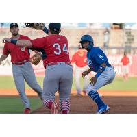 Errol Robinson of the Tulsa Drillers is caught in a rundown by the Springfield Cardinals