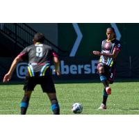 Las Vegas Lights FC defender Joel Huiqui (right) moves possession