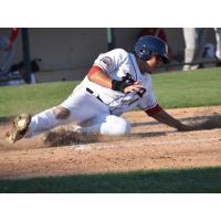 Ramon Flores of the Somerset Patriots slides home