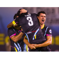 Las Vegas Lights FC players celebrate Joel Huiqui's (3) game-winning goal