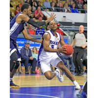 Kitchener-Waterloo Titans SG/SF Tramar Sutherland handles the ball against the Saint John Riptide