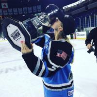 Emily Pfalzer of the Buffalo Beauts kissing the Isobel Cup