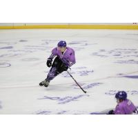 Tri-City Storm skate on Color Out Cancer ice