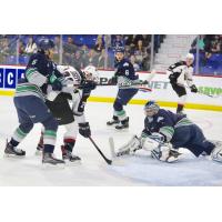 Jadon Joseph of the Vancouver Giants (center) tries to get off a shot against the Seattle Thunderbirds